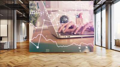 Double exposure of woman hands typing on computer and forex chart hologram drawing. Stock market invest concept. Wall mural