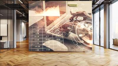 Double exposure of woman hands typing on computer and forex chart hologram drawing. Stock market invest concept. Wall mural