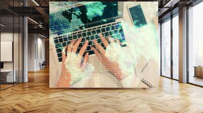 Double exposure of woman hands working on computer and financial theme hologram drawing. Top View. Business concept. Wall mural