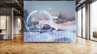 Double exposure of woman hands working on computer and world map hologram drawing. International technology business concept. Wall mural