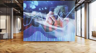 Financial forex graph displayed on hands taking notes background. Concept of research. Multi exposure Wall mural