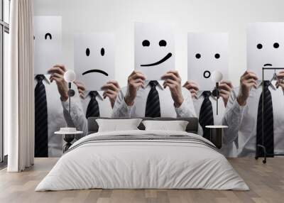 Five business men holding a card with emotional face Wall mural