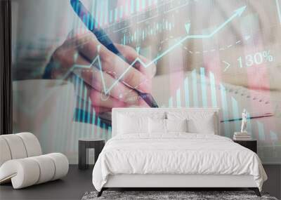 Forex chart displayed on woman's hand taking notes background. Concept of research. Double exposure Wall mural