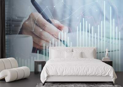 Forex chart displayed on woman's hand taking notes background. Concept of research. Double exposure Wall mural