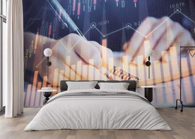 Forex graph on hand taking notes background. Concept of research. Double exposure Wall mural