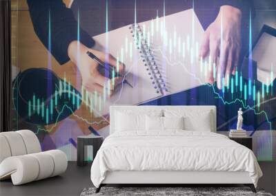 Forex graph on hand taking notes background. Concept of research. Multi exposure Wall mural