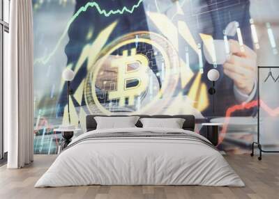 Man's hands working with notes background. Cryptocurrency and finance concept. Wall mural