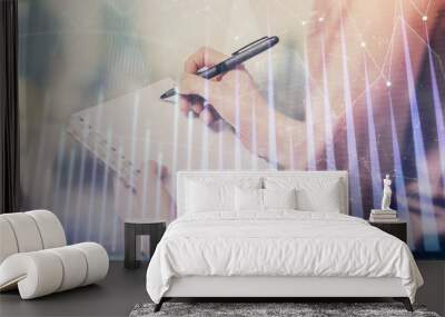 Multi exposure of hands making notes with forex chart huds. Stock market concept. Wall mural