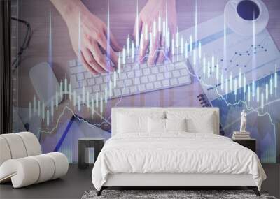 Multi exposure of man's hands typing over computer keyboard and forex graph hologram drawing. Top view. Financial markets concept. Wall mural