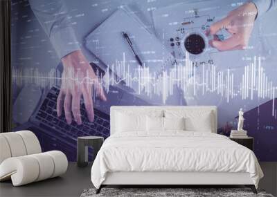 Multi exposure of man's hands typing over computer keyboard and forex graph hologram drawing. Top view. Financial markets concept. Wall mural