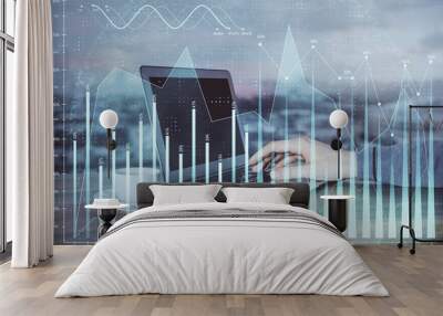 Multi exposure of market chart with man working on computer on background. Concept of financial analysis. Wall mural