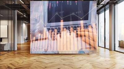 Multi exposure of market chart with man working on computer on background. Concept of financial analysis. Wall mural