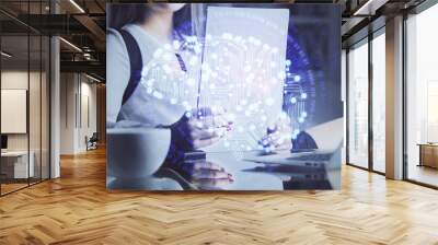 multi exposure of woman's writing hand on background with brain hud. concept of learning. Wall mural