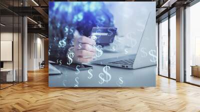 Multi exposure of woman on-line shopping holding a credit card and financial graph drawing. Stock market E-commerce concept. Wall mural