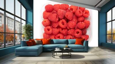 Whole fresh raspberries, in a clear plastic punnet, from above. Ripe, red and sweet fruits of Rubus idaeus, the cultivated European raspberry. Organic and vegan fruits. Isolated, close-up, food photo. Wall mural