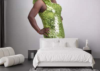 Drag queen wearing a green gown with sequins. Wall mural