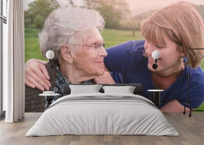 Happy senior woman together with young woman Wall mural