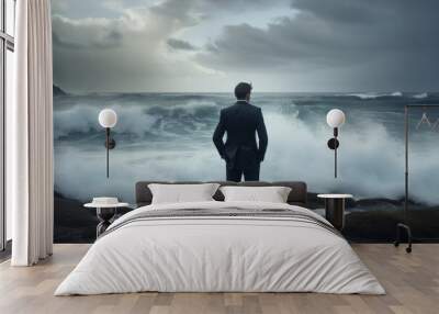 Rear view of businessman standing on rock in the ocean facing oncoming waves, created with Generative AI
 Wall mural