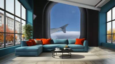 In-flight view trough window on aircraft wing tip fence Wall mural