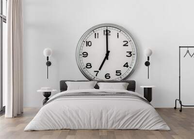 White Clock hanging on a white wall showing time 7:00 Wall mural