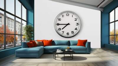 White Clock hanging on a white wall showing time 7:45 Wall mural