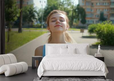 Young woman in workout attire embracing the summer sunlight in a park, with closed eyes and face lifted. An ultra-realistic 4K close-up capturing her happiness and tranquility while engaging in outdoo Wall mural