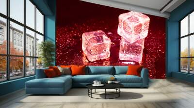 ice cubes on a reflections red light. Wall mural