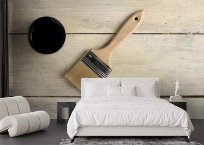 A brush lies next to a thermos with a cup on an old white vintage wooden board. Place for text or logo. Wall mural