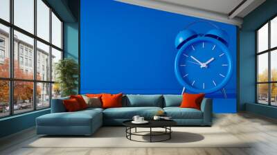 Blue vintage alarm clock on blue background - modern design - 3D Illustration Wall mural