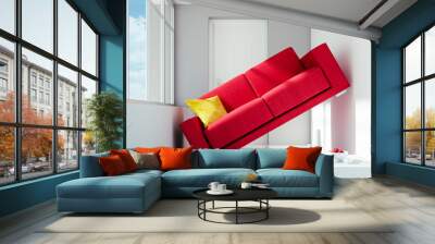 too big red sofa with problem to fit in a small white room Wall mural