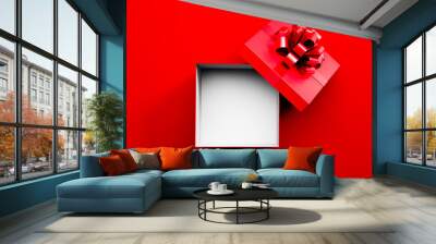 White and red opened empty gift box with red ribbon isolated on red background - 3D illustration	 Wall mural