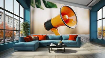 A 3D render of a vibrant orange megaphone with black detailing Wall mural