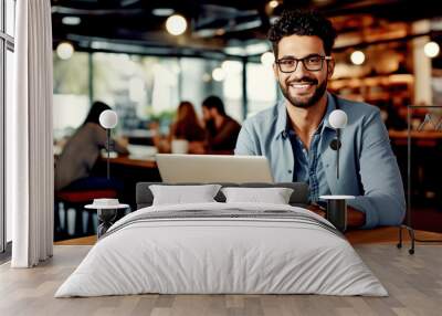 businessman working on laptop in cafe. Wall mural