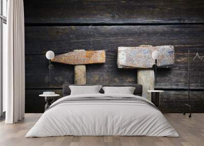 Close up of two old used hammer on a rustic wooden background. Selective focus Wall mural