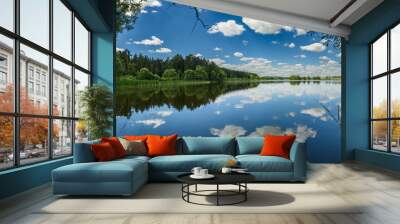 Lake in the forest with sky and clouds reflection Wall mural