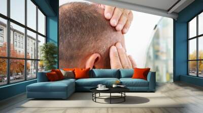 Senior man and hair loss issue Wall mural