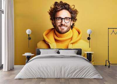 A cheerful man, wearing glasses, has a snow-white smile on a colored background Wall mural