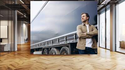 Truck driver standing by his lorry Wall mural