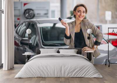 Woman with keys by the car Wall mural