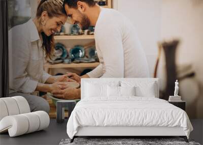 Young couple at a pottery class together Wall mural