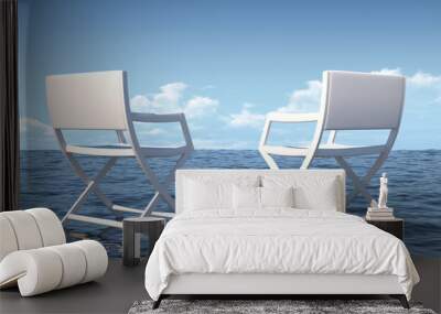 two white chairs in the sea overlooking the horizon Wall mural