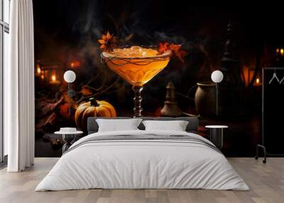 Close up view of tasty orange cocktail in a glass with decor for Halloween, on dark background Wall mural