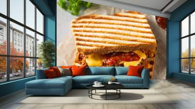 Close up view of tasty sloppy joe sandwich with ground meat, sauce and cheese on light background Wall mural