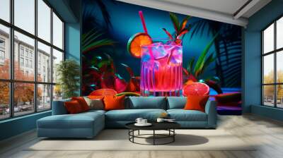 Colorful cocktails in a glass on the bar counter, neon lights on dark night background with lights Wall mural