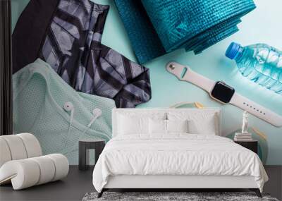 Healthy lifestyle, sport or athlete's equipment set on bright background. Flat lay. Top view with copy space. Wall mural