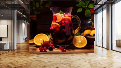 Homemade red wine sangria with orange, apple, strawberry and ice in pitcher and glass on rustic wooden background Wall mural