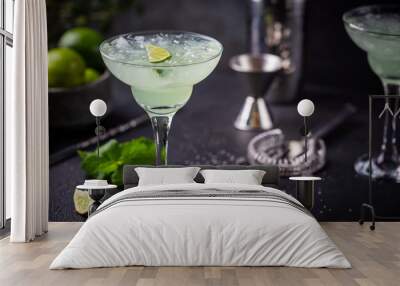 margarita cocktail with lime in a glass on dark background Wall mural