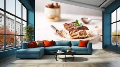 Piece of traditional Italian dessert tiramisu on white background Wall mural