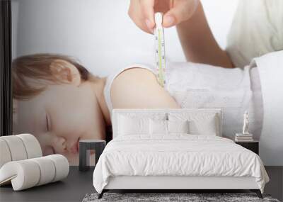 child has a high temperature or fever, using a thermometer Wall mural