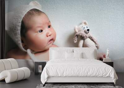 newborn baby asian boy sleeping at blue background Wall mural